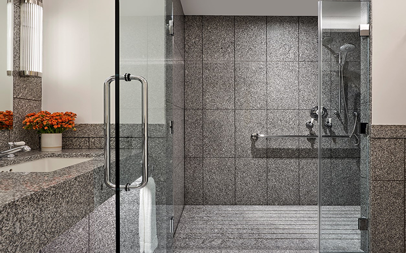 grey granite wall and floor in bathroom